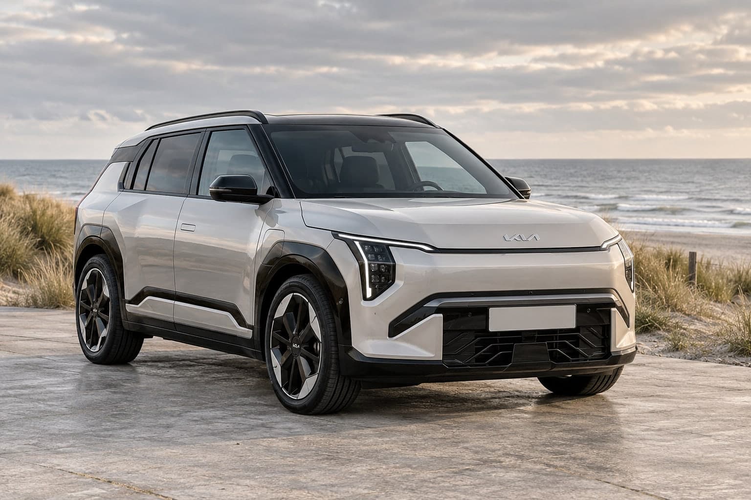Kia EV3 beside a sandy Baltic coastal landscape
